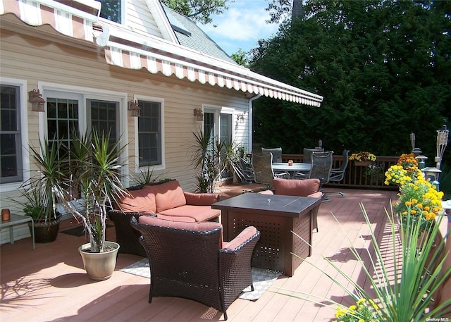 wooden deck with an outdoor living space