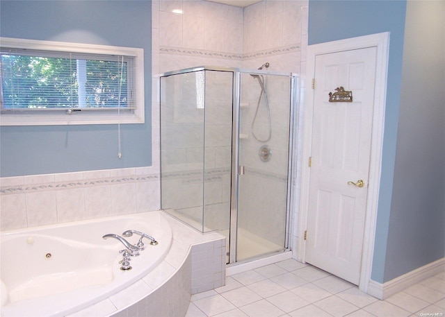 bathroom with tile patterned floors and independent shower and bath