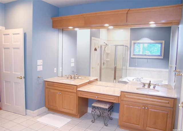 bathroom with tile patterned flooring, vanity, and shower with separate bathtub