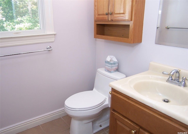 bathroom with tile patterned floors, vanity, and toilet