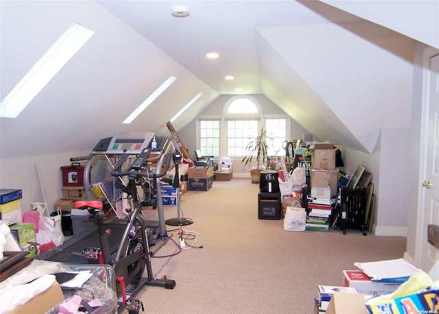 workout room with lofted ceiling and carpet floors