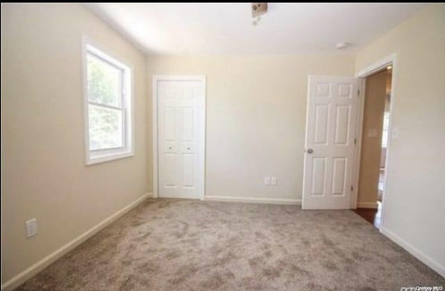 unfurnished bedroom featuring carpet floors