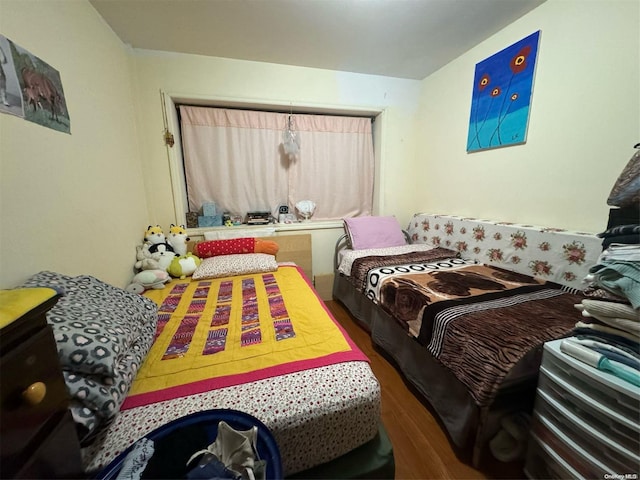 bedroom featuring dark hardwood / wood-style flooring