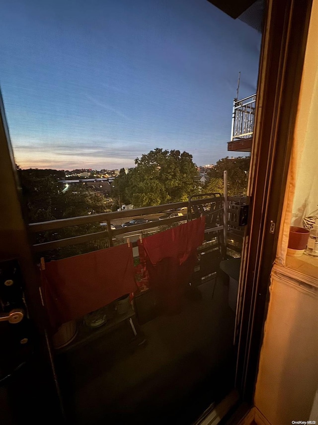 view of balcony at dusk