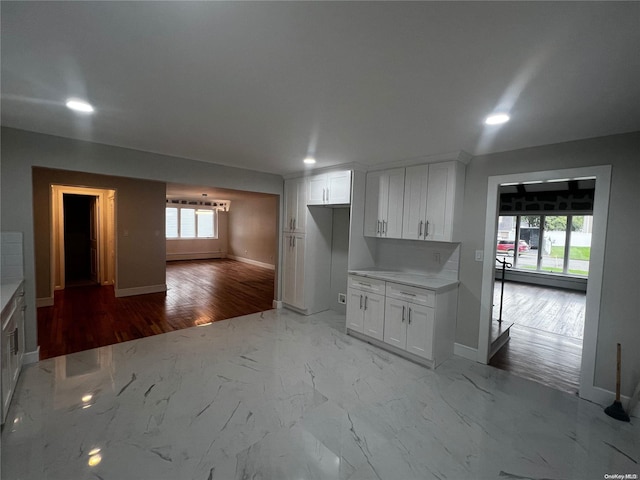 kitchen featuring white cabinets and light hardwood / wood-style floors