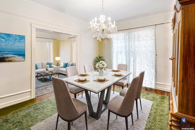 dining space with a chandelier and wood-type flooring