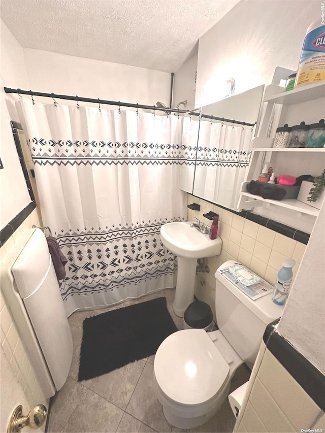 bathroom featuring radiator heating unit, walk in shower, tile patterned flooring, a textured ceiling, and toilet