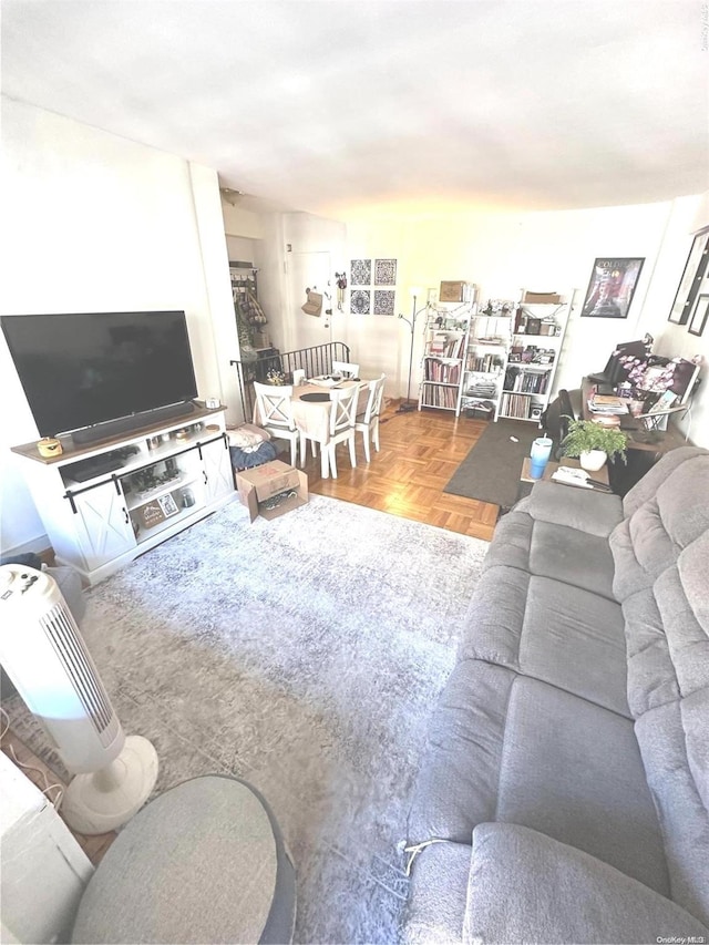 living room featuring parquet floors