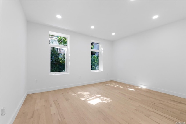 unfurnished room with light hardwood / wood-style floors