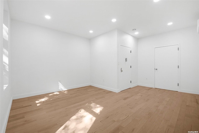 spare room with light hardwood / wood-style floors