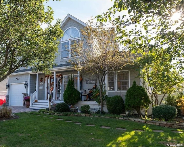 view of front of house featuring a front lawn and a garage