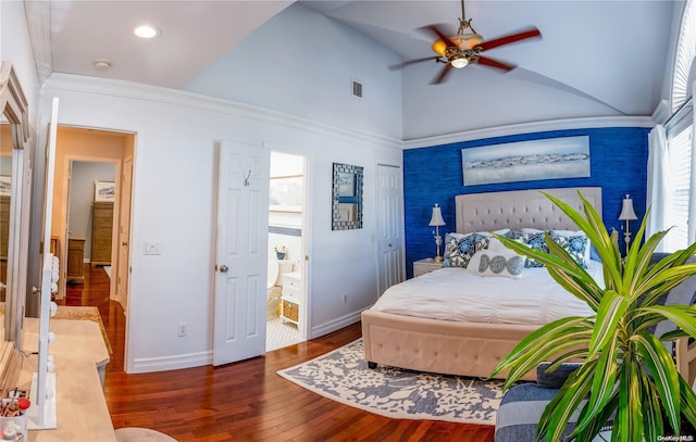 bedroom featuring dark wood-type flooring, high vaulted ceiling, crown molding, ensuite bath, and ceiling fan