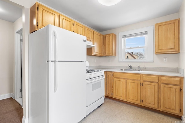 kitchen featuring white appliances and sink