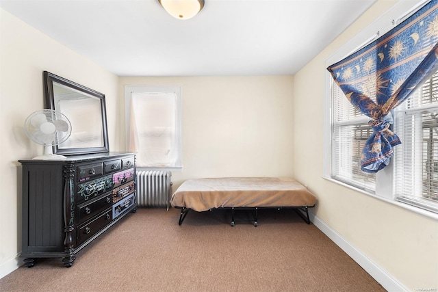 bedroom with carpet and radiator