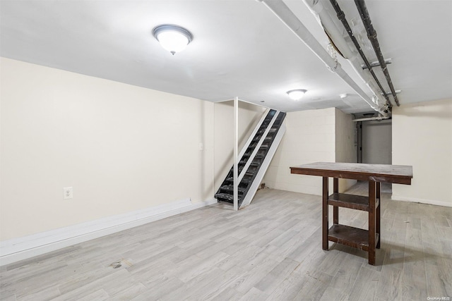 basement featuring light hardwood / wood-style floors