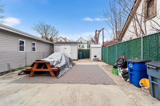 view of patio / terrace featuring a storage shed