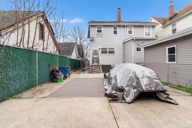 back of property with a patio area