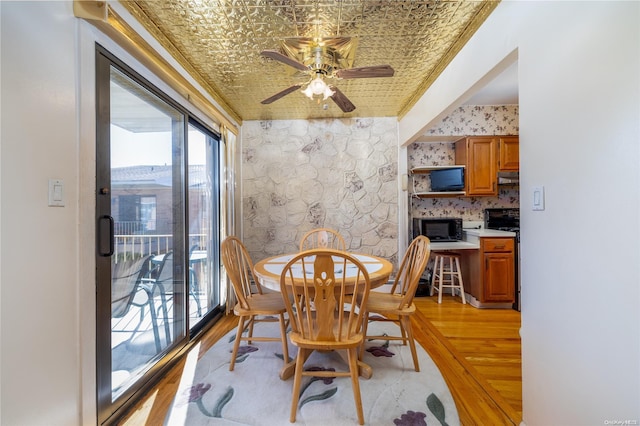 dining space featuring ceiling fan and light hardwood / wood-style floors