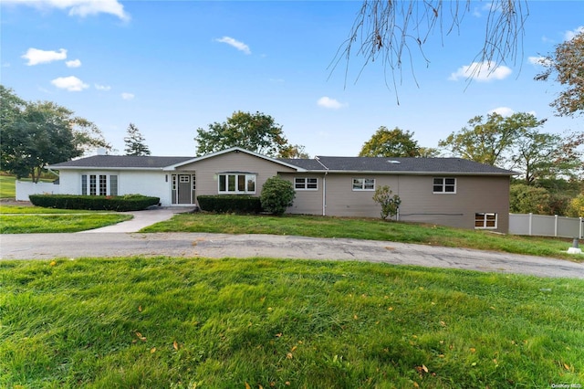 ranch-style house with a front lawn