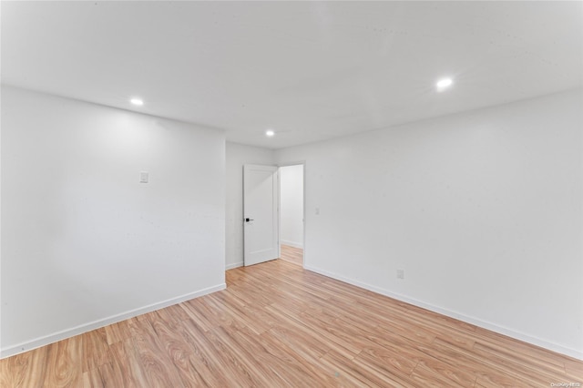 unfurnished room with light hardwood / wood-style flooring