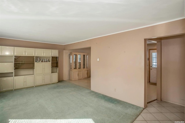 carpeted spare room featuring ornamental molding