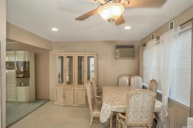 dining area featuring ceiling fan and a wall mounted air conditioner