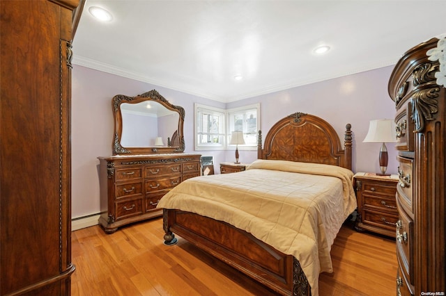 bedroom with baseboard heating, light hardwood / wood-style floors, and ornamental molding