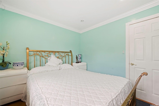 carpeted bedroom with ornamental molding