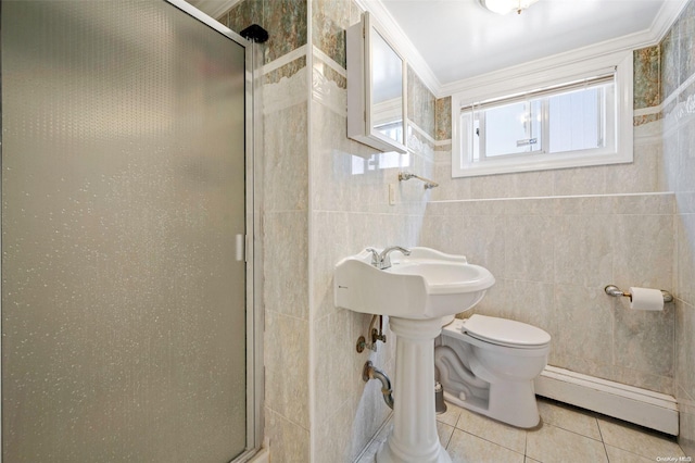 bathroom featuring a shower with shower door, ornamental molding, baseboard heating, and tile walls