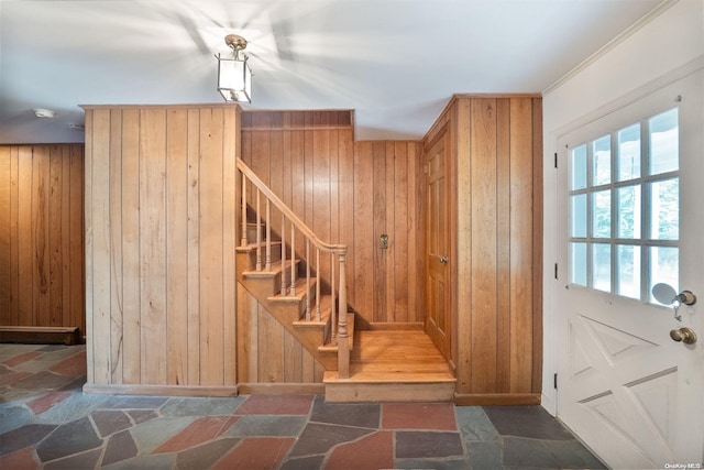 stairs with wood walls