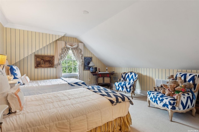 carpeted bedroom with lofted ceiling