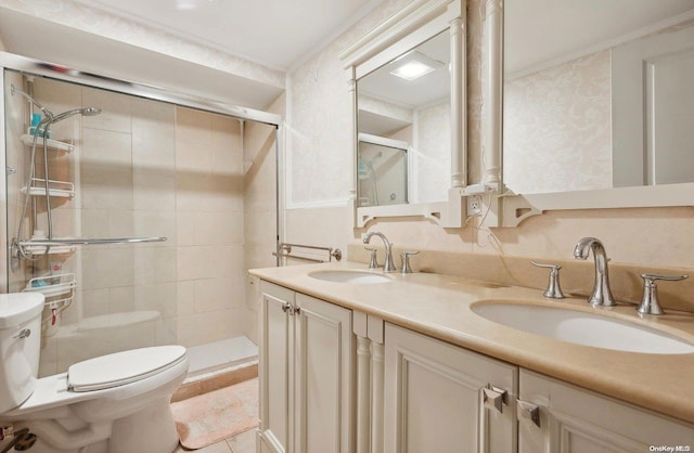 bathroom featuring tiled shower, tile patterned floors, vanity, and toilet