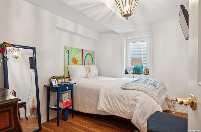 bedroom with wood-type flooring