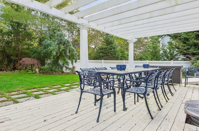 wooden deck featuring a pergola and a yard