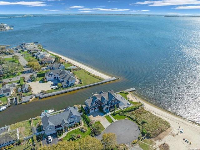 bird's eye view featuring a water view and a beach view