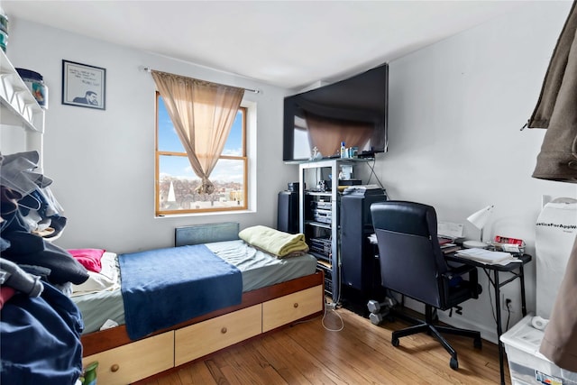 bedroom featuring hardwood / wood-style floors