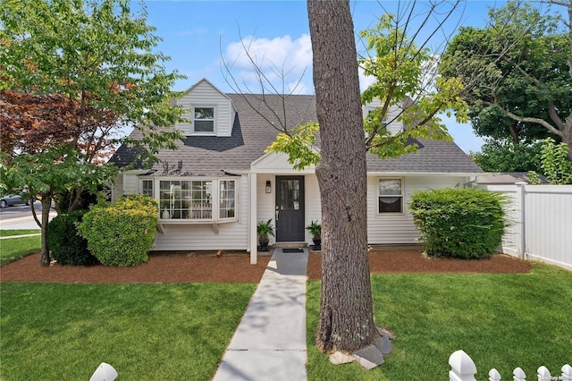 new england style home with a front yard