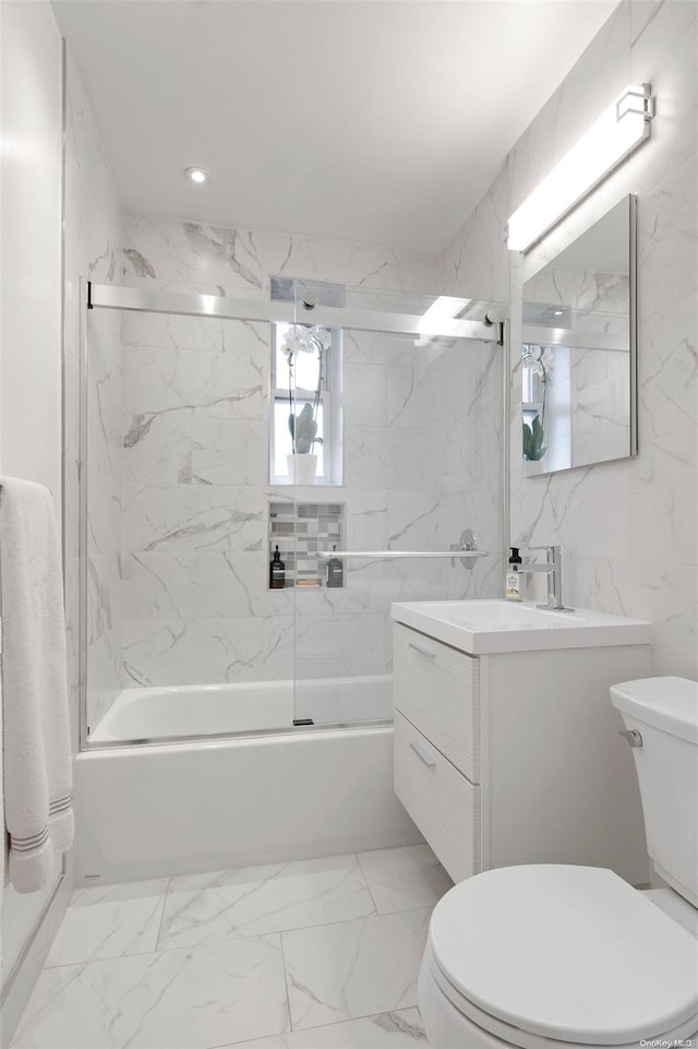 full bathroom featuring vanity, enclosed tub / shower combo, and toilet