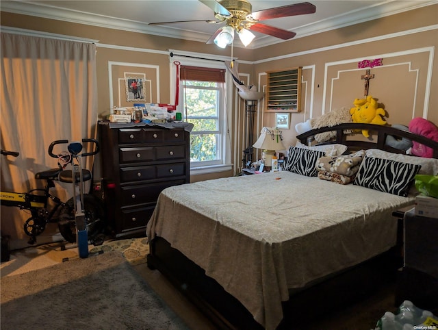 carpeted bedroom featuring ceiling fan and ornamental molding