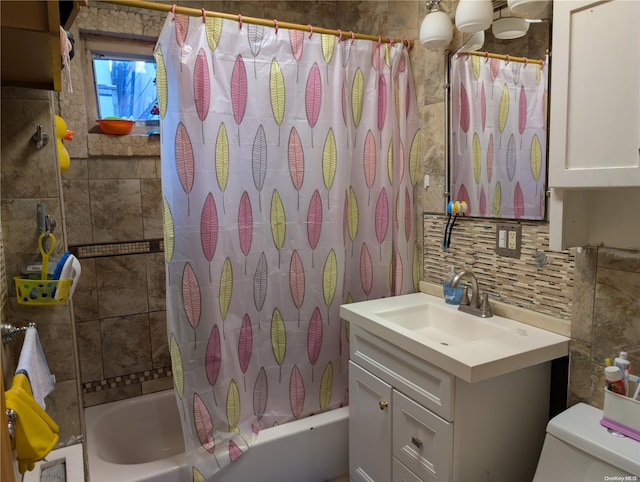 full bathroom featuring vanity, tasteful backsplash, toilet, and shower / bath combo with shower curtain