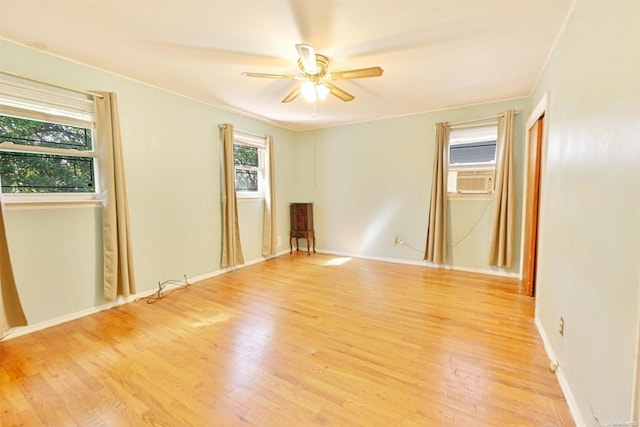 unfurnished room with ceiling fan, light hardwood / wood-style flooring, and ornamental molding