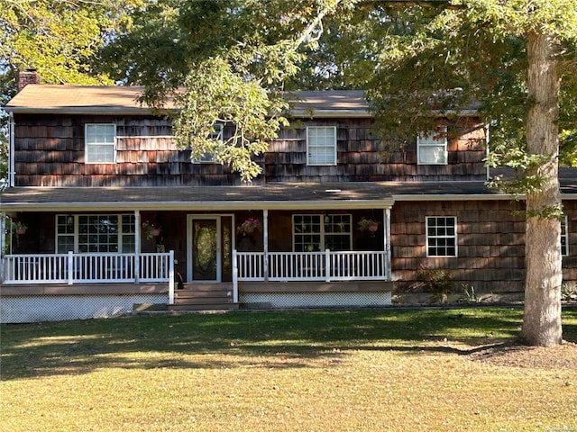 view of front of house with a porch and a front yard