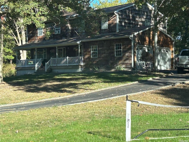 view of front of home featuring a porch and a front lawn