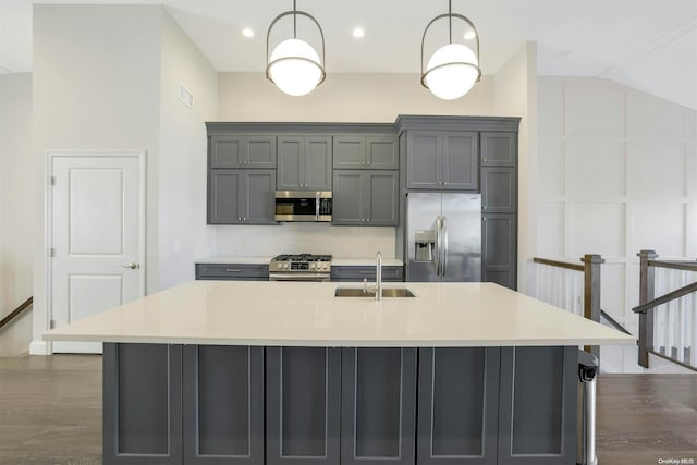 kitchen featuring gray cabinets, sink, hanging light fixtures, and appliances with stainless steel finishes