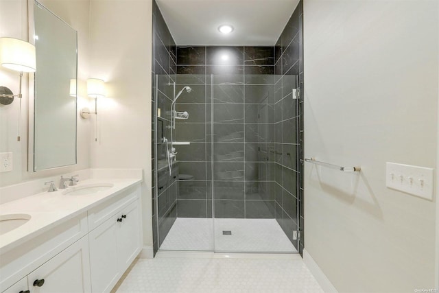 bathroom featuring tile patterned flooring, vanity, and an enclosed shower