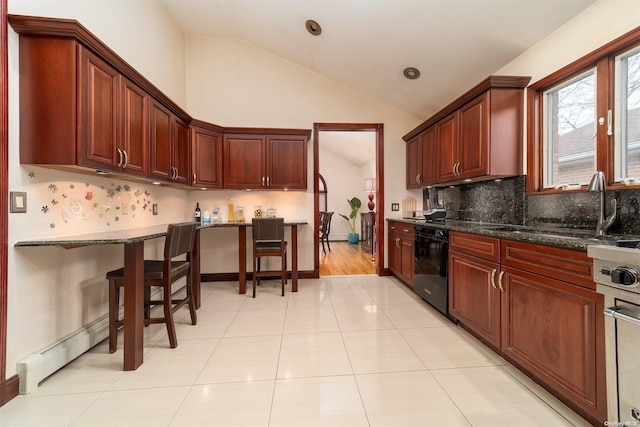 kitchen with dishwasher, sink, vaulted ceiling, dark stone countertops, and light tile patterned floors