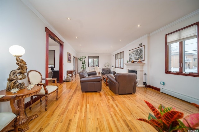 living room with light hardwood / wood-style floors, a baseboard radiator, and crown molding