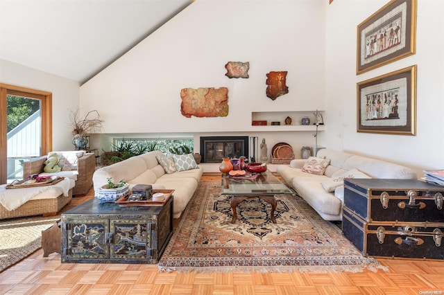 living room with parquet flooring and high vaulted ceiling