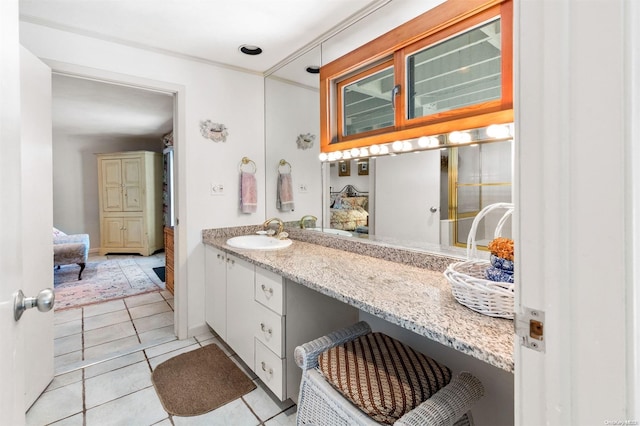 bathroom with tile patterned flooring and vanity