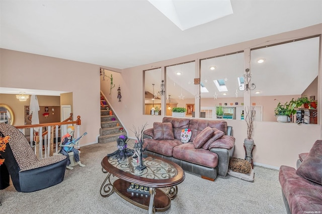 carpeted living room featuring lofted ceiling with skylight